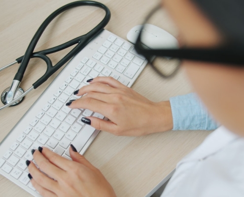 Professional healthcare administration office workspace representing behavioral health documentation and compliance