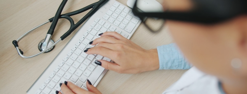 Professional healthcare administration office workspace representing behavioral health documentation and compliance