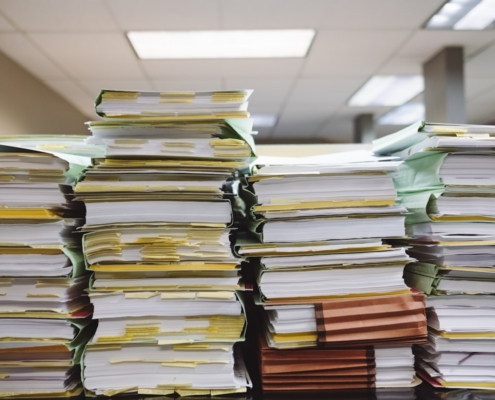 Office desk with audit preparation materials representing the structured 90-day sprint for behavioral health payer audits