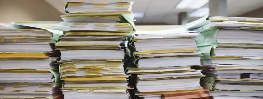 Office desk with audit preparation materials representing the structured 90-day sprint for behavioral health payer audits