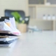 Stack of patient chart files and pen on a behavioral health compliance officer desk during an ASAM dimension documentation review
