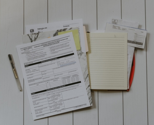 stack of papers flat lay photography