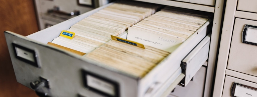 Open file cabinet drawer of patient records illustrating 42 CFR Part 2 confidentiality rules for substance use disorder records