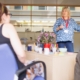 Trainer leading a behavioral health compliance training session at a flip chart