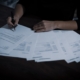 Signing the licensing and legal paperwork required to open a rehab center in California
