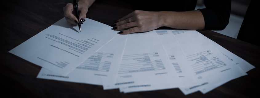 Signing the licensing and legal paperwork required to open a rehab center in California